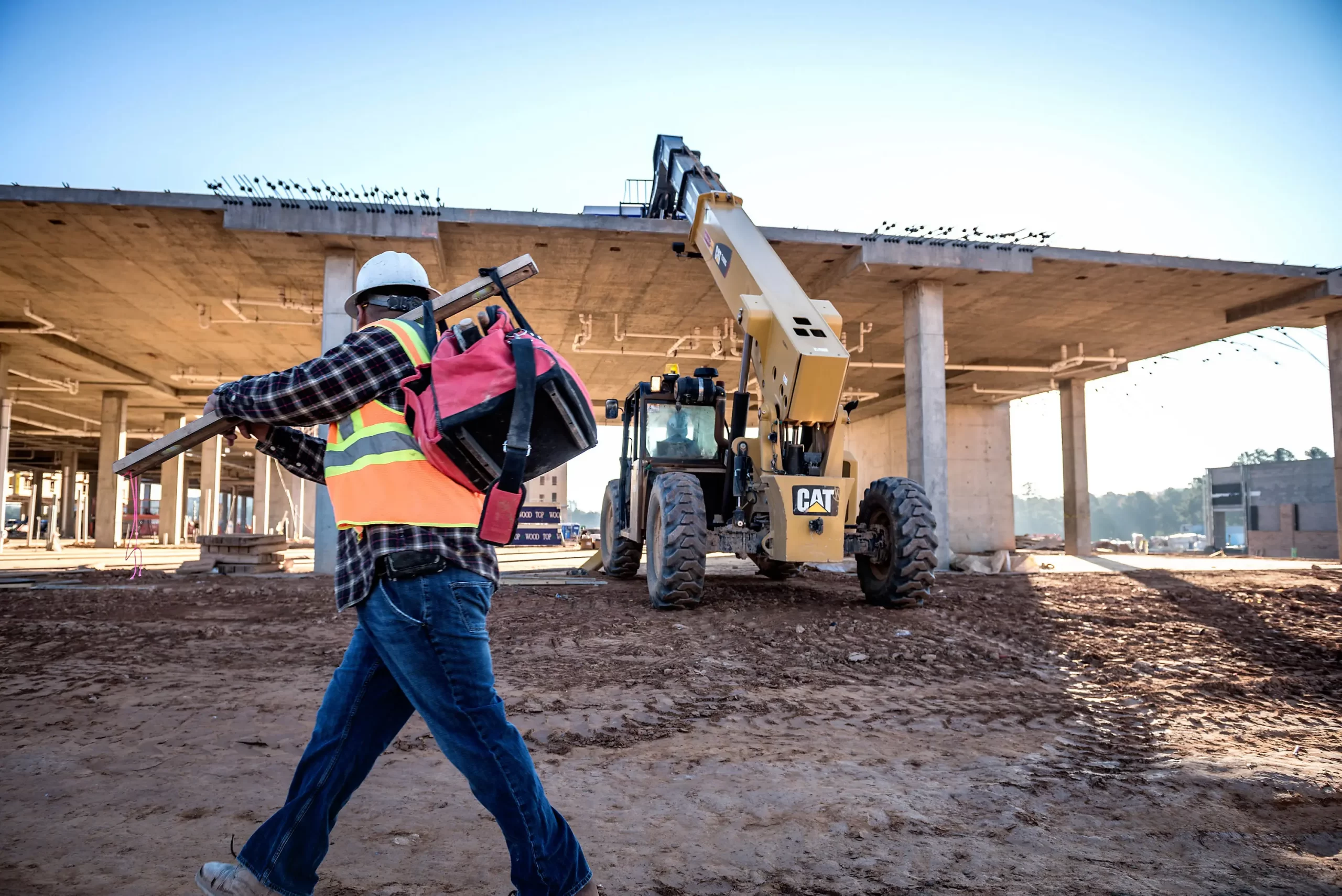 Telehandler loading supplies onto a rooftop