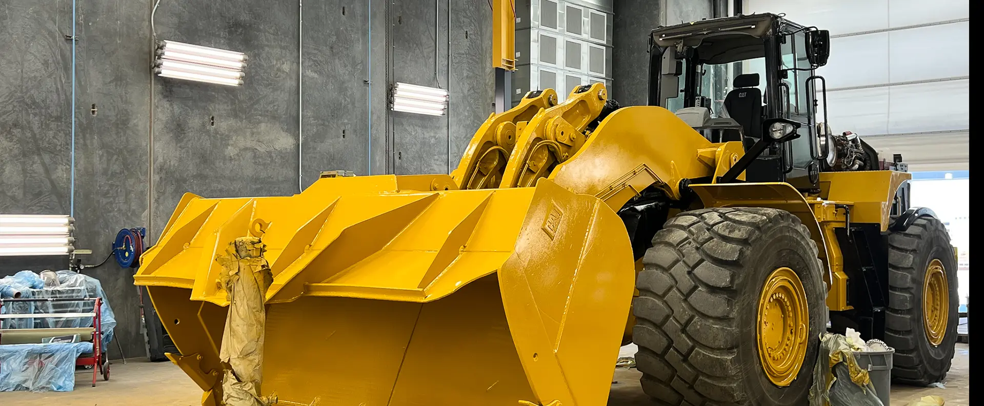 980 front loader in Wheeler's paint booth